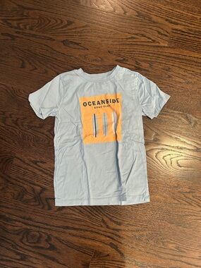 Surf Club Light Blue Kids Tee with surf graphic